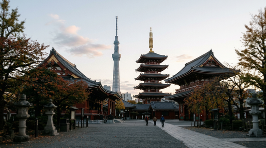 Sensō-ji temple buildings and five-story pagoda in autumn, with Tokyo Skytree rising in the background.